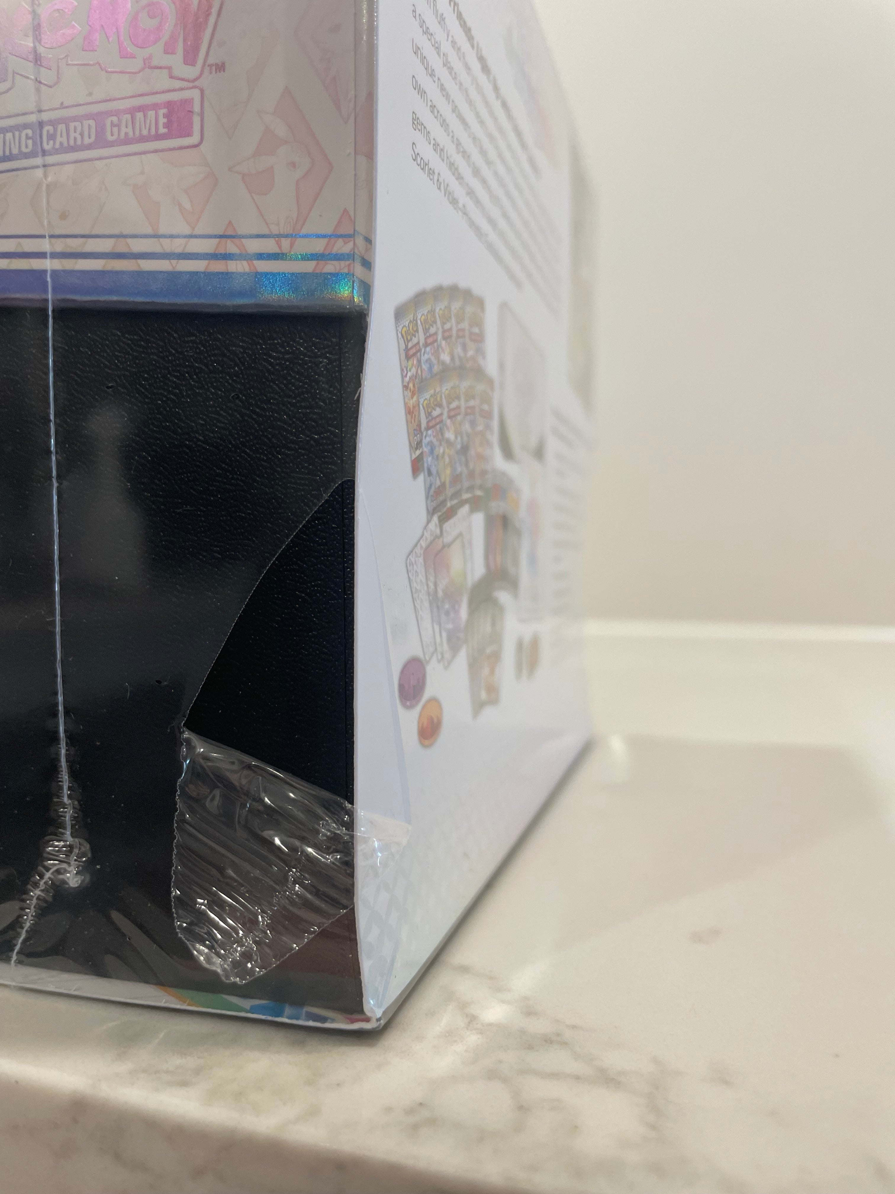 [SEALED WITH TEAR] Pokémon TCG: Prismatic Evolutions – Elite Trainer Box (ETB)